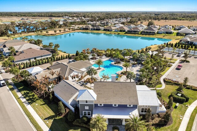 14538 Barefoot Ln, Parrish, FL 34219 - aerial view of residential area with a pool and a large body of water