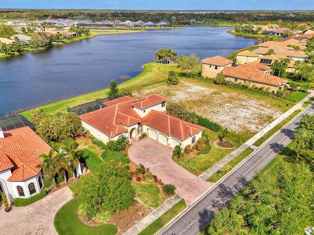 birds eye view of property with a water view