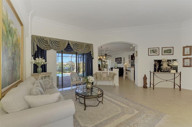 tiled living room featuring ornamental molding and ceiling fan