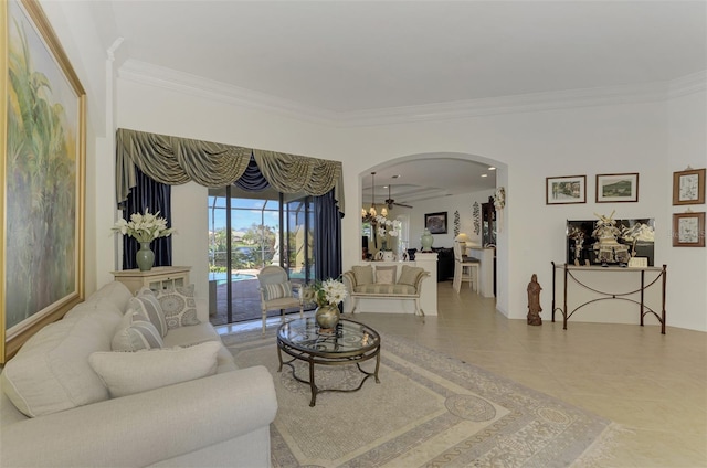 1509 Raphis Royale Blvd, Englewood, FL 34223 - tiled living room with arched walkways, ornamental molding, and a ceiling fan
