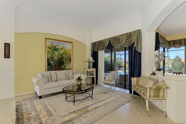 1509 Raphis Royale Blvd, Englewood, FL 34223 - tiled living room with ornamental molding, plenty of natural light, arched walkways, and baseboards