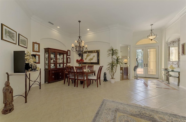 tiled dining space with crown molding, an inviting chandelier, and french doors