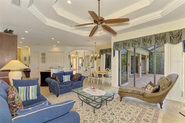 1509 Raphis Royale Blvd, Englewood, FL 34223 - living area with arched walkways, a tray ceiling, ornamental molding, ceiling fan, and recessed lighting