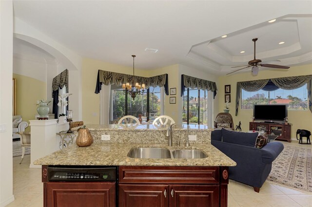 1509 Raphis Royale Blvd, Englewood, FL 34223 - kitchen with a sink, open floor plan, dishwasher, dark brown cabinets, and ceiling fan