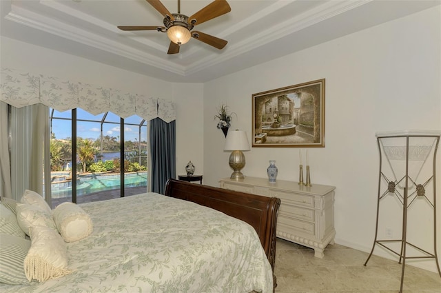 bedroom with crown molding, a raised ceiling, ceiling fan, and access to exterior