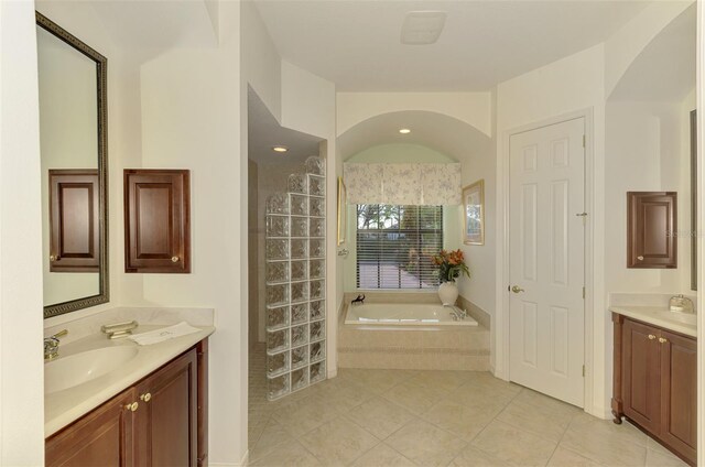 1509 Raphis Royale Blvd, Englewood, FL 34223 - full bathroom with tile patterned floors, a garden tub, and two vanities