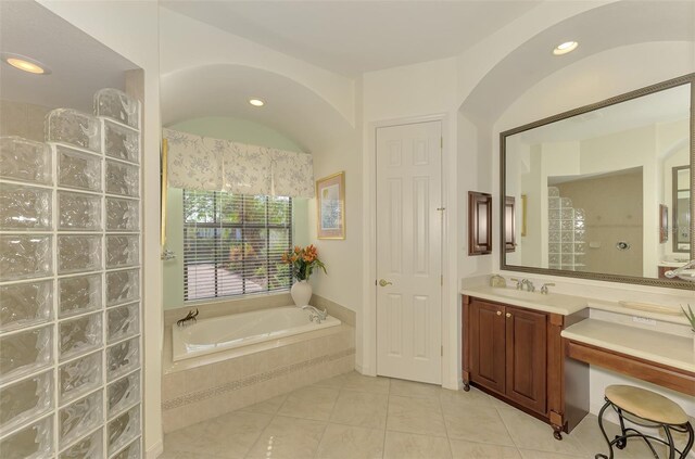 1509 Raphis Royale Blvd, Englewood, FL 34223 - full bath with tile patterned flooring, a bath, vanity, recessed lighting, and a walk in shower