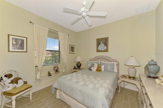 1509 Raphis Royale Blvd, Englewood, FL 34223 - bedroom with wood finish floors, baseboards, and a ceiling fan