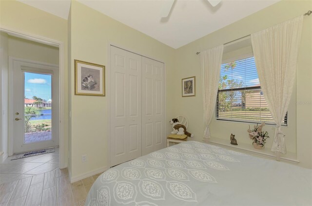 1509 Raphis Royale Blvd, Englewood, FL 34223 - bedroom featuring multiple windows, a closet, baseboards, and access to exterior