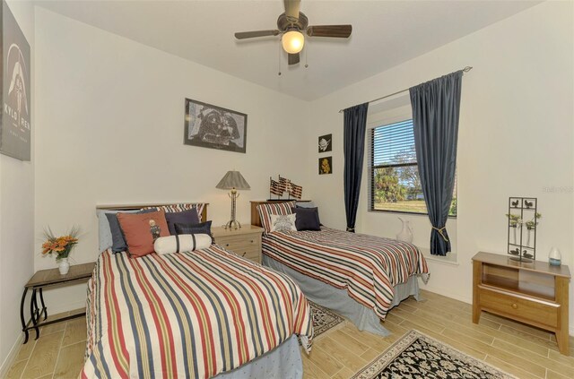 1509 Raphis Royale Blvd, Englewood, FL 34223 - bedroom featuring wood finished floors, baseboards, and a ceiling fan