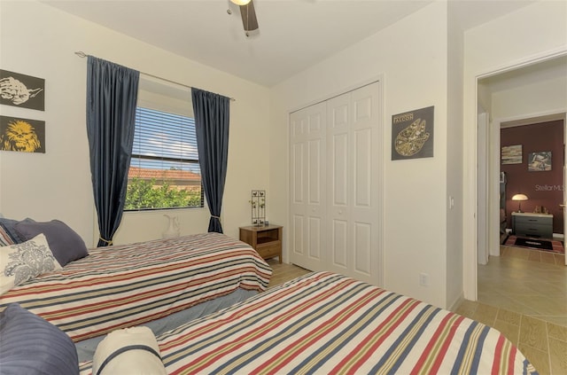 bedroom featuring ceiling fan and a closet