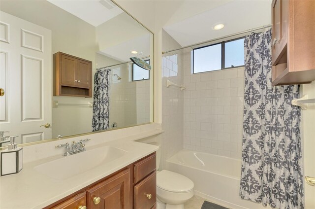 1509 Raphis Royale Blvd, Englewood, FL 34223 - full bathroom featuring toilet, shower / tub combo with curtain, and vanity