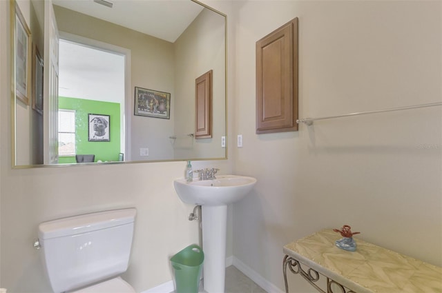 bathroom with sink and toilet