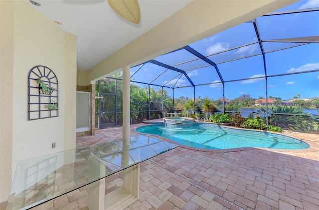 view of pool with a patio area, a lanai, ceiling fan, and an in ground hot tub