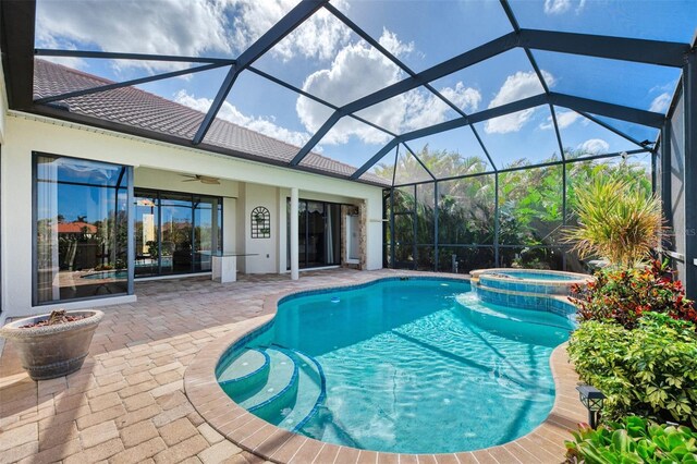 1509 Raphis Royale Blvd, Englewood, FL 34223 - view of pool with a patio area, a ceiling fan, a pool with connected hot tub, and a lanai