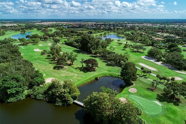 1509 Raphis Royale Blvd, Englewood, FL 34223 - drone / aerial view of a golf club, a nearby body of water, and a tree filled landscape