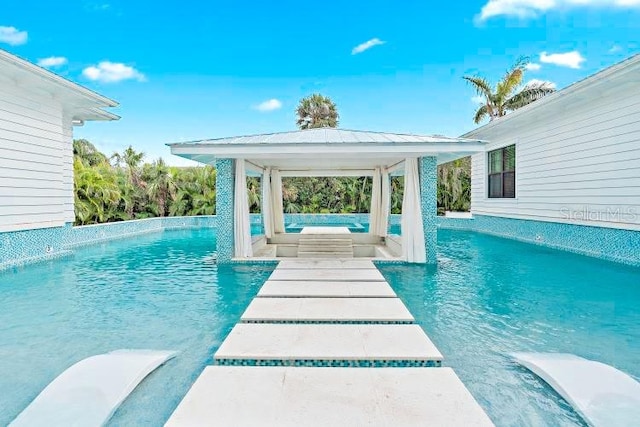 view of pool with pool water feature