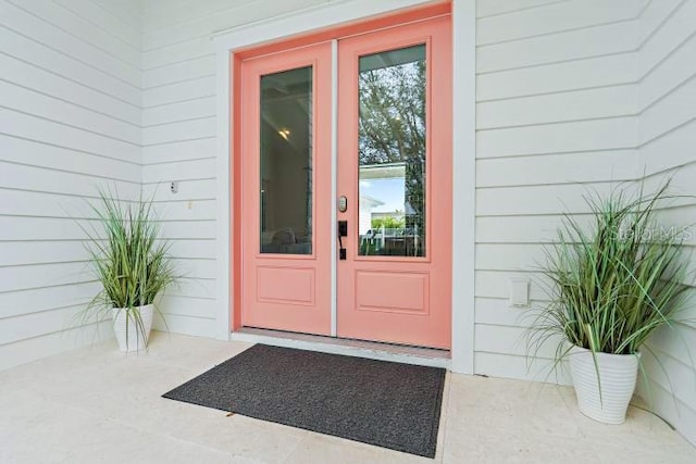 view of exterior entry featuring french doors