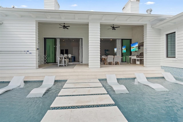 view of patio / terrace with ceiling fan and area for grilling