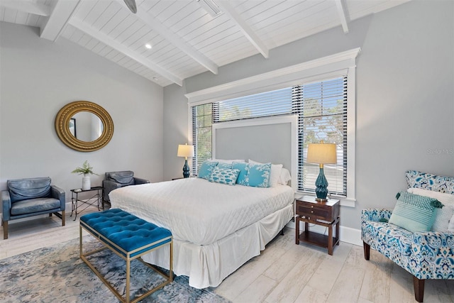 bedroom with vaulted ceiling with beams, wood ceiling, and light hardwood / wood-style flooring