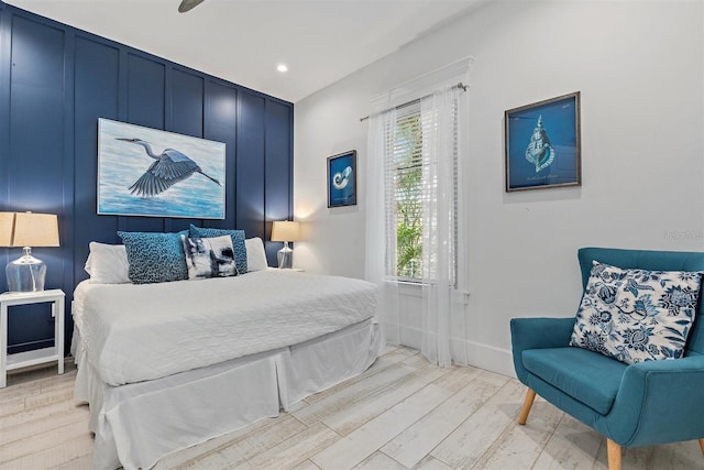 bedroom with ceiling fan and light hardwood / wood-style flooring