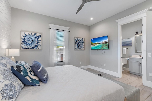 bedroom featuring ceiling fan and connected bathroom