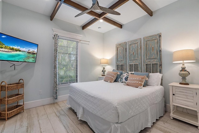 bedroom featuring ceiling fan, beamed ceiling, and light hardwood / wood-style flooring