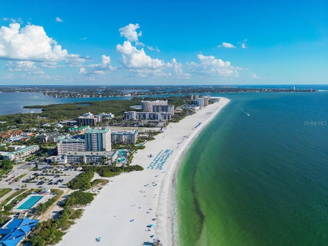 aerial view with a water view and a view of the beach