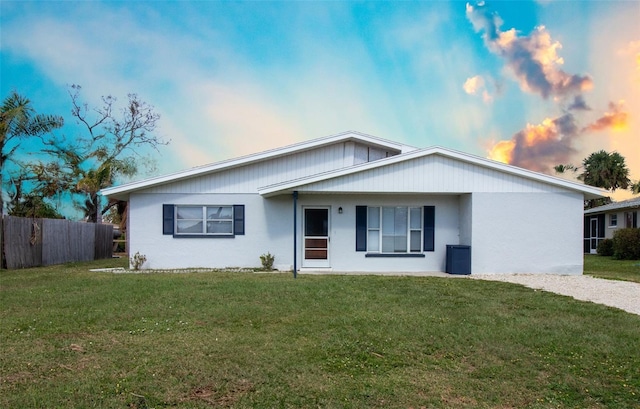 ranch-style house featuring a lawn