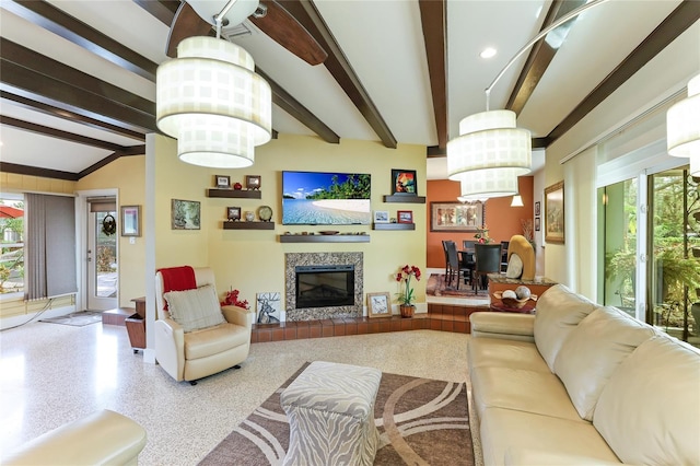 living room featuring a fireplace and vaulted ceiling with beams