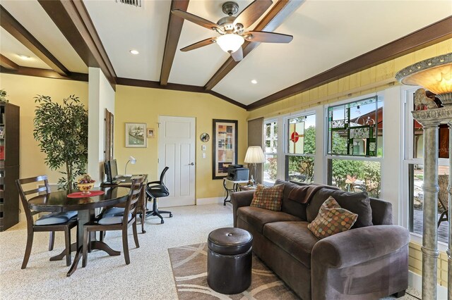 living room featuring lofted ceiling with beams, light carpet, and ceiling fan