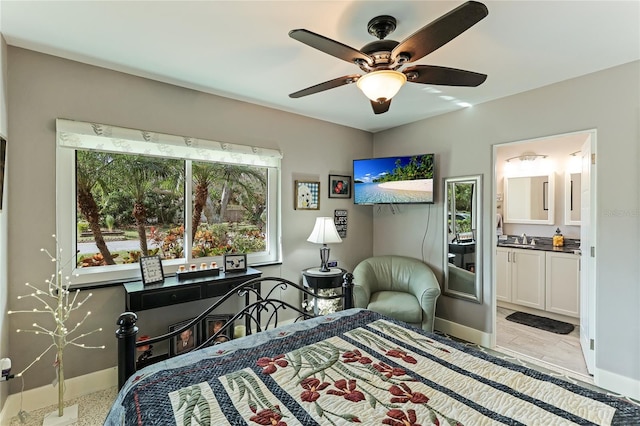 bedroom featuring ensuite bathroom and ceiling fan