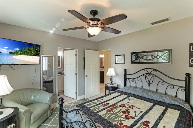 bedroom featuring ensuite bathroom and ceiling fan