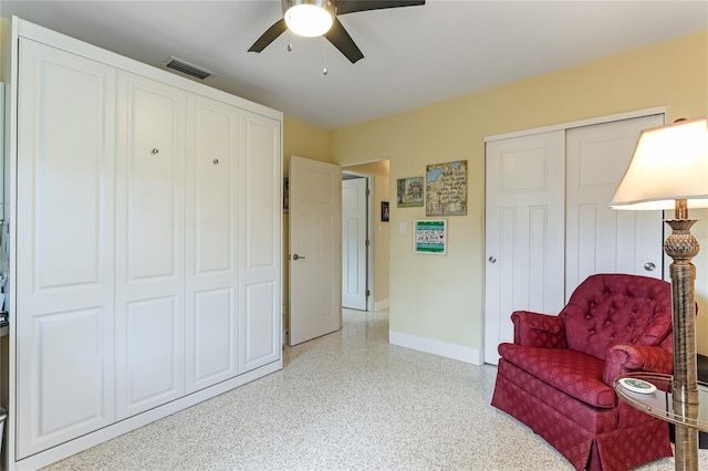 sitting room featuring ceiling fan