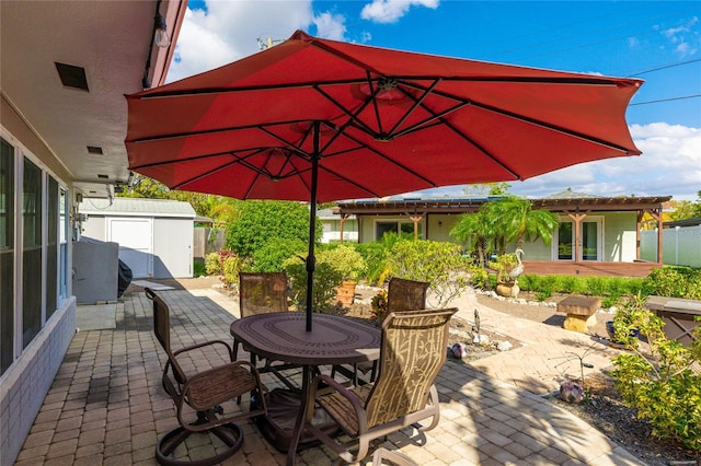 view of patio featuring a shed