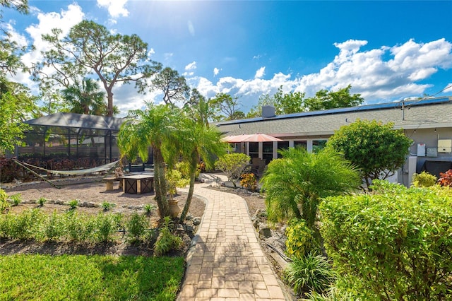 surrounding community featuring a patio area and an outdoor fire pit