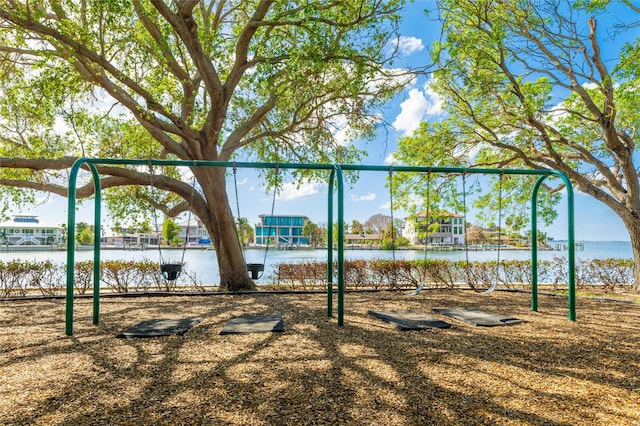 view of jungle gym featuring a water view