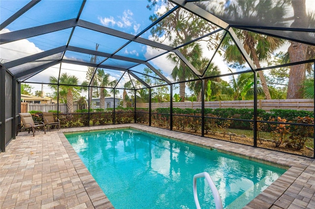 view of pool with a lanai and a patio area