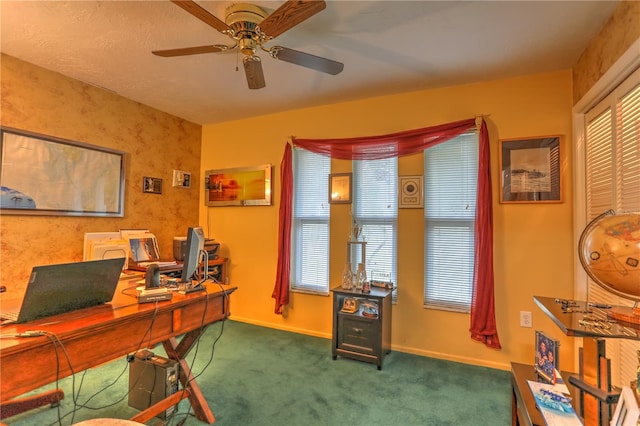 home office featuring dark colored carpet and ceiling fan