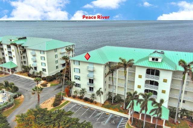 birds eye view of property with a water view