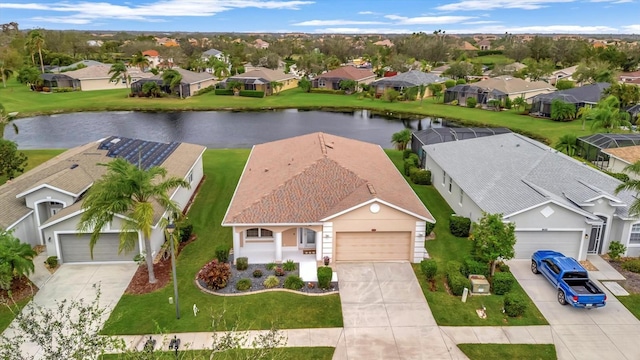 birds eye view of property with a water view