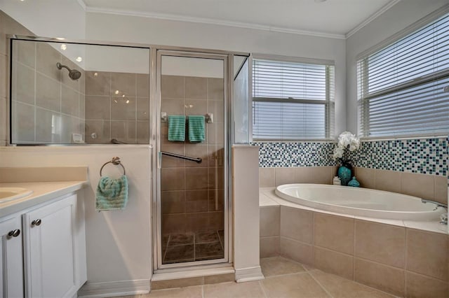 bathroom featuring independent shower and bath, tile patterned flooring, vanity, and crown molding