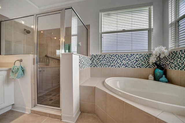 bathroom featuring tile patterned flooring, vanity, crown molding, and independent shower and bath