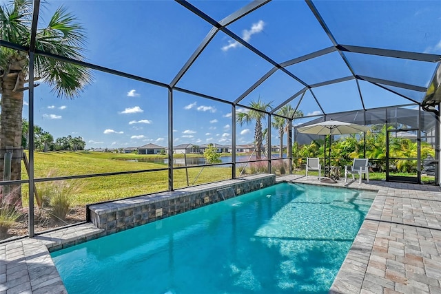 view of swimming pool with a yard, a lanai, a patio, and pool water feature