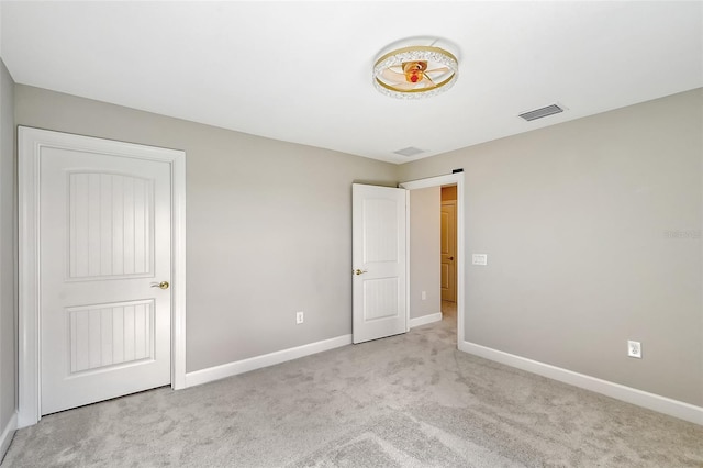 unfurnished bedroom with light carpet