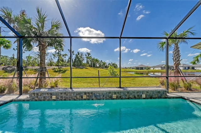 view of pool featuring a yard and glass enclosure