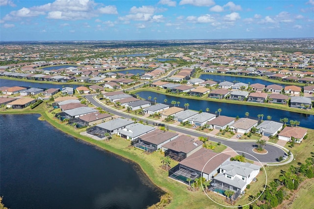 drone / aerial view with a water view