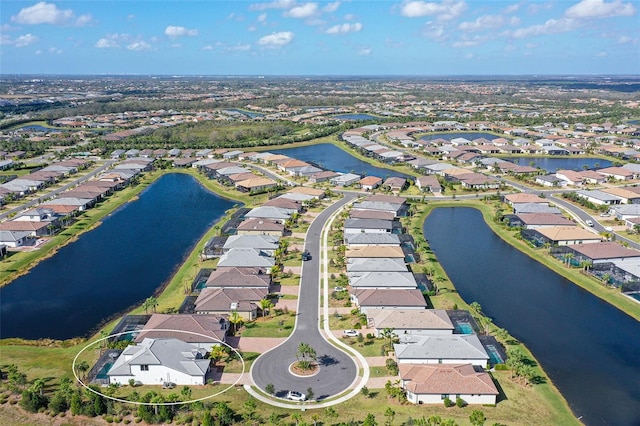 drone / aerial view with a water view