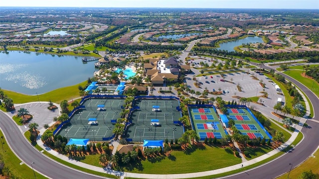 birds eye view of property with a water view