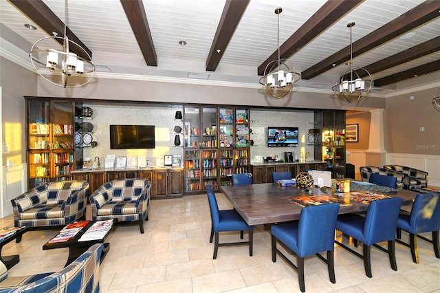 dining space with an inviting chandelier and beam ceiling